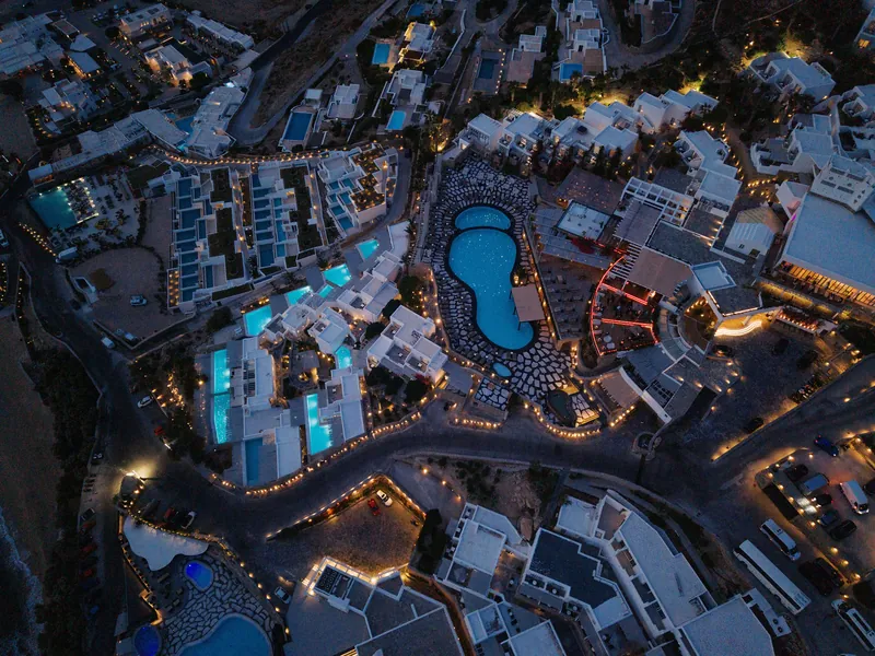 Night aerial view of the illuminated Royal Myconian on Mykonos